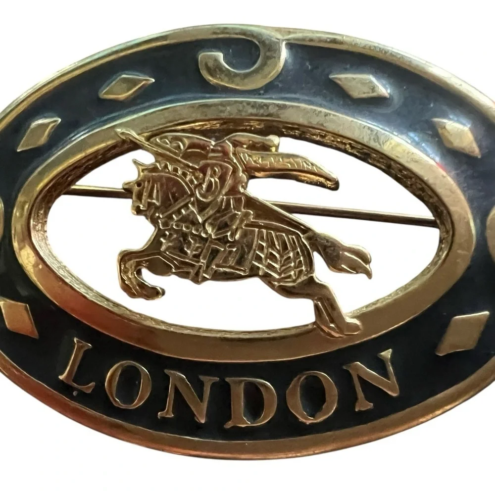 Burberry Gold and Black Brooch